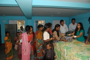 Distributing gifts for the kids and their parents.